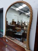 A PINE FRAMED OVERMANTLE MIRROR. 105cms HIGH.