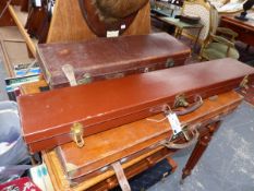 A LEATHER RIFLE CASE. TWO LEG O' MUTTON GUN CASES AND TWO OTHERS