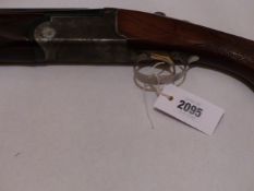 A BROWNING MEDALIST 12G O/U MULTICHOKE SHOTGUN . SERAIL NUMBER 148807 (ST NO 3252)