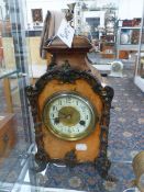 A VICTORIAN WALNUT AND BRASS MOUNTED MANTLE CLOCK