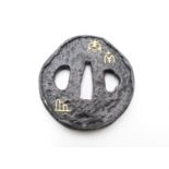 A SHOAMI IRON TSUBA, INCISED AND SET WITH GOLD CHARACTERS