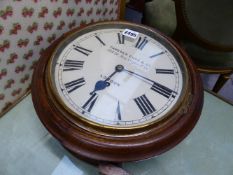 A WALL TIMEPIECE CLOCK, THE DIAL INSCRIBED CAMERER CUSS & CO. 24cms DIAL