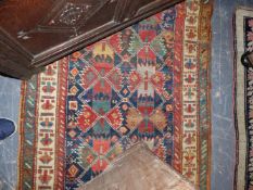 AN ANTIQUE CAUCASIAN KAZAK RUG, 258x112 AND ANOTHER SMALLER KARABAUGH RUG.