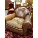 A GOOD QUALITY EARLY 20TH.C.LEATHER UPHOLSTERED CLUB ARMCHAIR