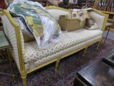 AN ANTIQUE GILT SHOW FRAME SALON SETTEE.