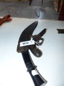 A DOUBLE BARRELLED PERCUSSION BOXLOCK POCKET PISTOL TOGETHER WITH A KUKRI, CONTAINED IN IT'S WHITE