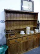 A LARGE ANTIQUE PINE DRESSER WITH PLATE RACK. APPROX 184cms WIDE.