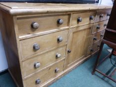 A LARGE VICTORIAN PINE KITCHEN DRESSER BASE. 180cms WIDE