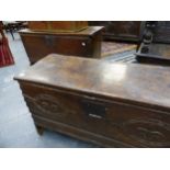 A 17TH.C.OAK PLANK COFFER WITH CARVED FRIEZE AND A SIMILAR PLAIN OAK PANEL COFFER. 93cms AND