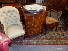 A VICTORIAN BUTTON BACK LOW ARMCHAIR TOGETHER WITH A GEORGIAN COUNTRY OAK RUSH SEAT ARMCHAIR.