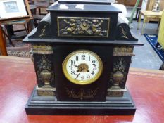 A LARGE VICTORIAN SLATE MANTLE CLOCK AND ONE OTHER SMALL CLOCK.