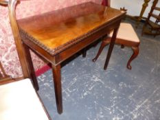 AN EARLY GEO.III.MAHOGANY FOLD OVER TEA TABLE ON CHAMFER SQUARE TAPER LEGS. 92cms WIDE