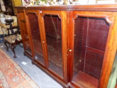 A LATE VICTORIAN MAHOGANY GLAZED BREAKFRONT BOOKCASE. 214cms WIDE x 130 HIGH