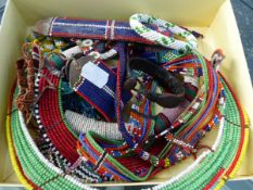 A COLLECTION OF VARIOUS NORTH AMERICAN INDIAN TRIBAL BEAD NECKLACES AND DECORATIONS