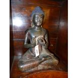 AN ORIENTAL PATINATED BRONZE FIGURE OF BUDDHA WITH TRACES OF GILT AND POLYCHROME DECORATION. 38CM
