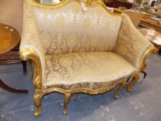 A CARVED GILDED SHOW FRAME HIGH BACK SALON SETTEE. APPROX 152cms WIDE