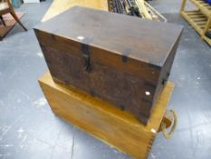 AN ANTIQUE COLONIAL CARVED HARDWOOD IRON BOUND CAMPAIGN TRUNK WITH CARRYING HANDLES TOGETHER WITH