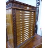A VICTORIAN OAK COLLECTOR'S CHEST OF FOURTEEN SHALLOW DRAWERS WITH CARVED IVORY HANDLES. 56cms