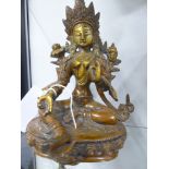 AN EASTERN BRONZE FIGURE OF A SEATED DIETY ON A LOTUS FORM BASE. 21CM HIGH