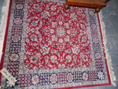 AN ORIENTAL RUG OF PERSIAN DESIGN. 127x120cms.