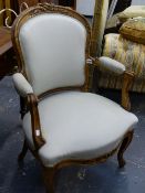 A CONTINENTAL WALNUT SHOW FRAME SALON ARMCHAIR.