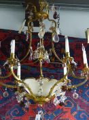 A GOOD QUALITY FRENCH BRASS AND GLASS CHANDELIER HUNG WITH BUNCHES OF FRUIT.