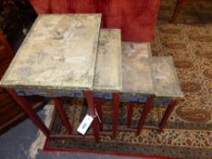 NEST OF FOUR CHINESE EXPORT CARVED AND PAINTED TABLES EACH WITH FIGURAL PARCHMENT TOPS