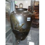 AN UNUSUAL EARLY 20TH CENTURY JAPANESE BRONZE VASE WITH RELIEF DECORATION OF A SAMURAI HELMET,