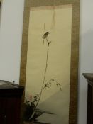 A JAPANESE SCROLL OF A SHRIKE PERCHED ON A BRANCH. CALLIGRAPHY ASCRIBED TO THE SWORDSMAN MYAMOTO