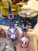 TWO BOHEMIAN BLUE GLASS DECANTERS. MADE AND DECORATED FOR THE PERSIAN MARKET. ENAMEL PORTRAIT