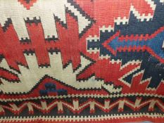 AN ANTIQUE CAUCASIAN KELIM CARPET. 328x180cms.