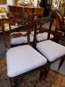 FOUR ANTIQUE CARVED ANGLO-COLONIAL HARDWOOD DINING CHAIRS WITH PAD SEATS.