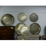 THREE LARGE SILVERED BRASS PERSIAN SERVING TRAYS AND THREE SIMILAR SMALLER EXAMPLES. LARGEST