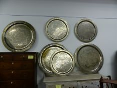 THREE LARGE SILVERED BRASS PERSIAN SERVING TRAYS AND THREE SIMILAR SMALLER EXAMPLES. LARGEST