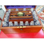 A VICTORIAN MAHOGANY APOTHECARY BOX WITH FITTED BOTTLES, SCALES AND PESTLE TOGETHER WITH A VINTAGE