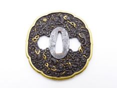 A FINE CHISELLED TSUBA, DECORATED WITH THREE TOED DRAGONS, ONE GRASPING A PEARL, HIGHLIGHTED IN GILT