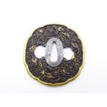 A FINE CHISELLED TSUBA, DECORATED WITH THREE TOED DRAGONS, ONE GRASPING A PEARL, HIGHLIGHTED IN GILT