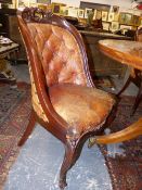 A SET OF TEN VICTORIAN MAHOGANY CARVED SHOW FRAME BUTTON LEATHER UPHOLSTERED DINING CHAIRS.