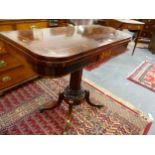 A REGENCY ROSEWOOD AND BRASS INLAID FOLD OVER CARD TABLE