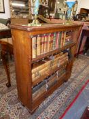 A SMALL VICTORIAN OAK BOOKCASE WITH TWO DRAWER BASE. 92cms WIDE