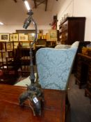 AN EARLY 20TH.C.TABLE LAMP THE BASE FORMED WITH THREE ELEPHANT FIGURES. 64cms HIGH OVERALL