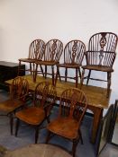 SEVEN YEW WOOD AND ELM WHEELBACK CHAIRS TO INCLUDE TWO ARMCHAIRS.