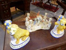 A 19TH CENTURY GERMANIC PORCELAIN TABLE CENTREPIECE, INCORPORATING FOUR CANDLE HOLDERS, SURMOUNTED