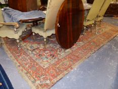 AN ANTIQUE PERSIAN HERIZ CARPET. 412x310cms.