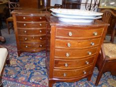 A PAIR OF MAHOGANY SMALL BOW FRONT FIVE DRAWER CHESTS. 62cms WIDE.