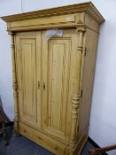 A PINE TWO DOOR WARDROBE, 119cms WIDE.