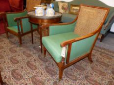 A PAIR OF MAHOGANY AND SATINWOOD BANDED BERGERE LIBRARY ARMCHAIRS