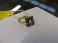 AN 18ct.DIAMOND AND EMERALD SQUARE SHAPED DRESS RING.