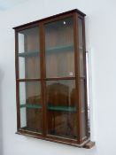 A MAHOGANY FRAMED SHELVED WALL CABINET. 96cms WIDE