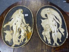 A PAIR OF ANTIQUE CAST IRON PLAQUES RELIEF CAST WITH CLASSICAL MAIDENS.